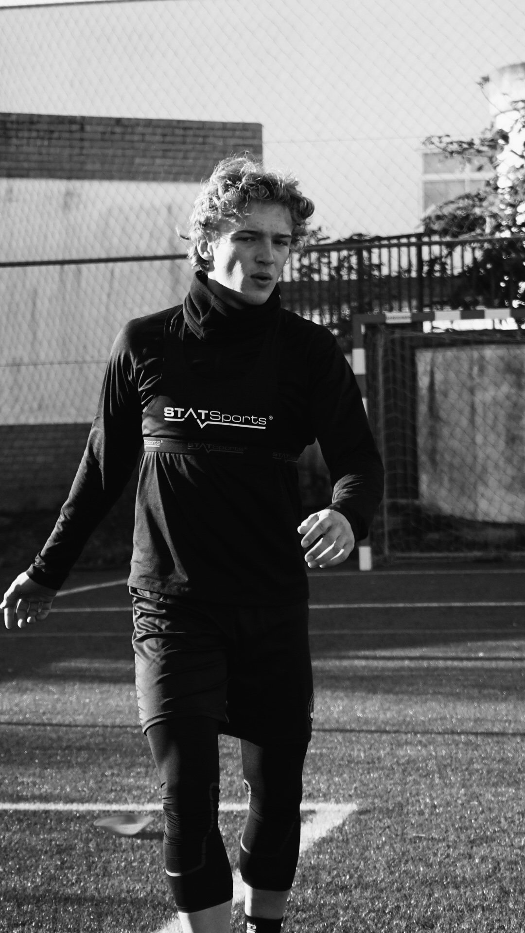 Baxter on the pitch, black and white documentary shot